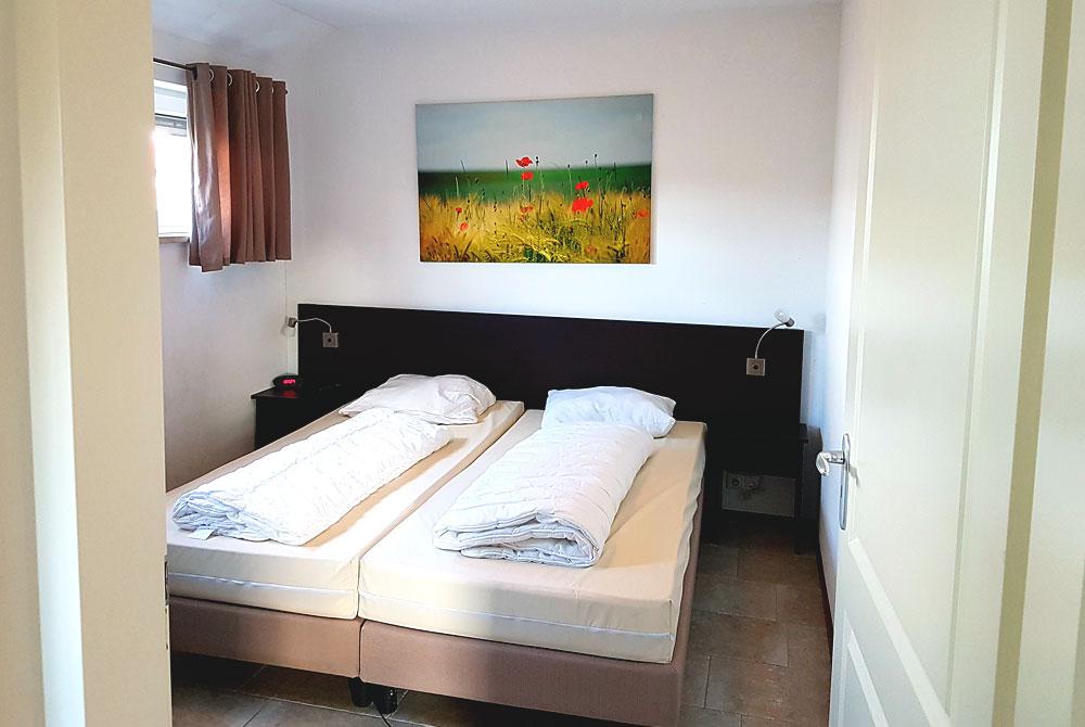 Slaapkamer in de vakantieboerderij, Buitenhof de Leistert