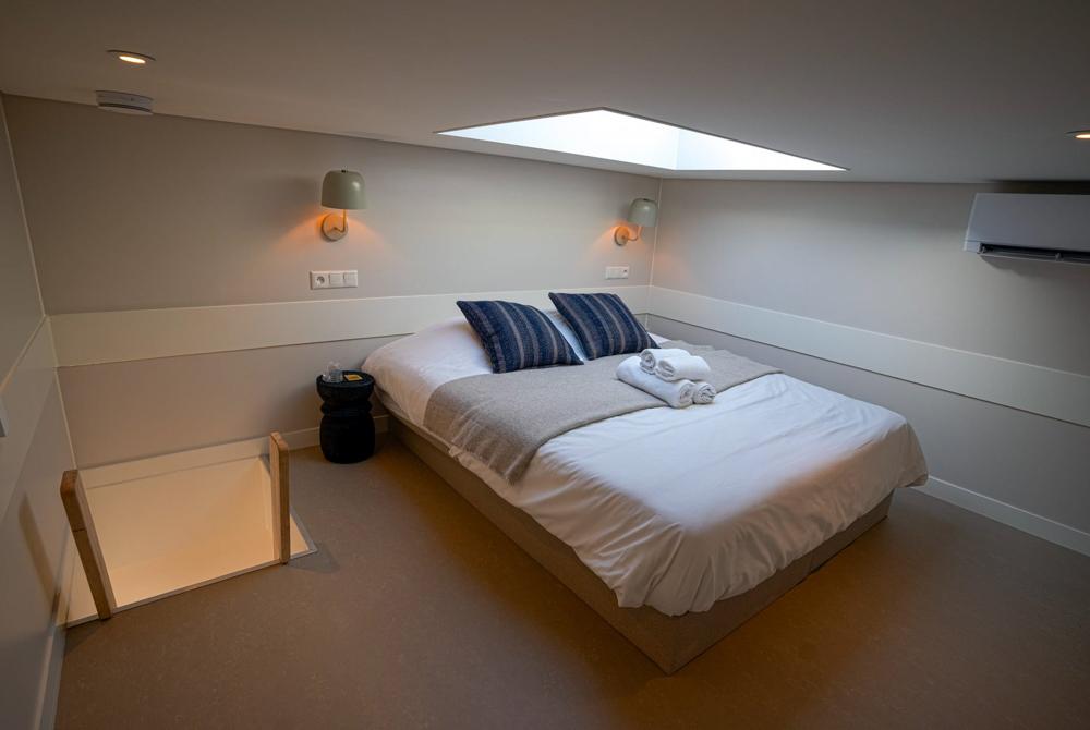 Skylight-slaapkamer met sterrenzicht